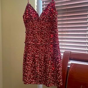 Large, short red dress with beige cherries and green leaves